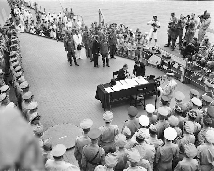 The Instrument of Surrender is signed on board the USS Missouri, 2 September 1945. NARA. Public Domain.